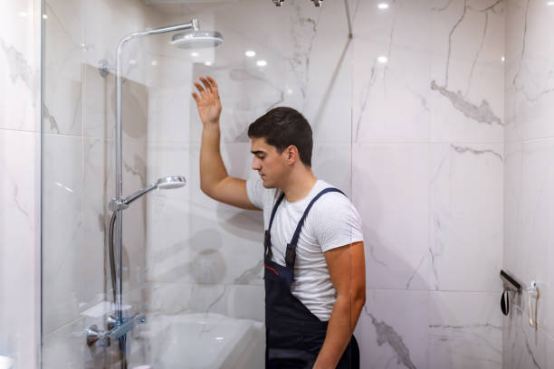 istock Installing a new shower hose on an used showerhead 1334258267