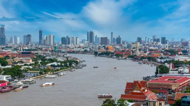 Photo of Aerial view Chao Phraya River Bangkok city urban downtown skyline of Thailand, Wat Arun Temple, Grand palace and Wat phra keaw, Business district with high building, Thailand