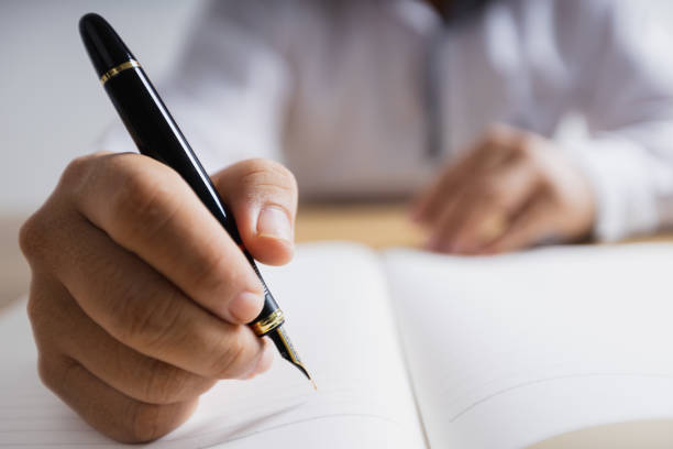 istock man writer writing on note paper, education and learning concept 1334259388