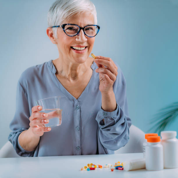 istock Senior Woman Taking Omega 3 EPA DHA Supplements 1334259413