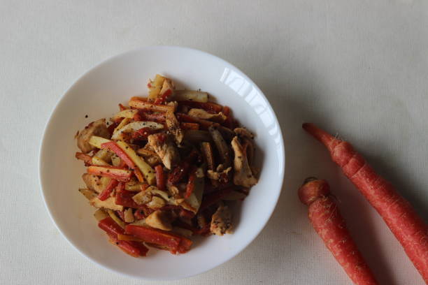 istock Stir fried potatoes carrots and chicken for lunch 1334259448