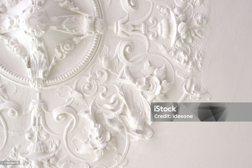 Classic Ceiling Ceiling part in rich stucco decor. Used to be decor element for a light fixture or luster. Moulding - Trim Stock Photo