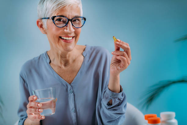 istock Senior Woman Taking Omega 3 EPA DHA Supplements 1334260761