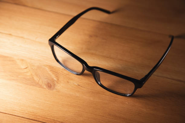 istock eye glasses on wooden desk 1334261046