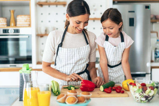 istock Mother and daughter in the kitchen 1334261759