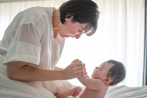 istock Mother singing lullaby for her bay to sleep 1334261844