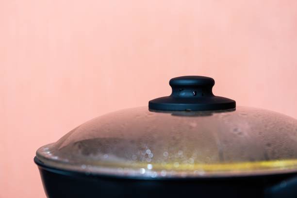 istock stewpan with lid covered with steam and water droplets 1334263481