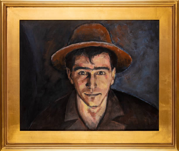 Frontal Portrait of a Young Man Oil Painting in a Frame Frontal portrait or self portrait oil painting of a young man with a hat in a gold wooden frame. impressionism photos stock pictures, royalty-free photos & images