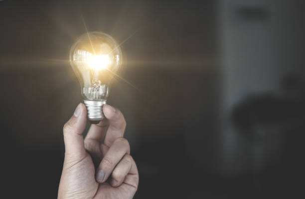 istock People holding glowing light bulb in idea, innovation and inspiration concept 1334267178