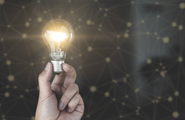 istock People holding glowing light bulb in idea, innovation and inspiration concept 1334267200