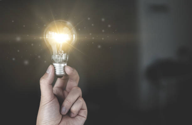 istock People holding glowing light bulb in idea, innovation and inspiration concept 1334267206