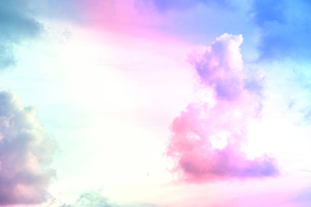 istock beauty abstract sweet pastel soft green with fluffy clouds on sky. multi color rainbow image. fantasy growing light 1334267247