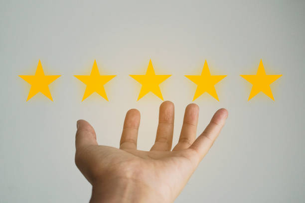 istock Customer review good rating concept hand pressing five star on visual screen and positive customer feedback testimonial. 1334267284