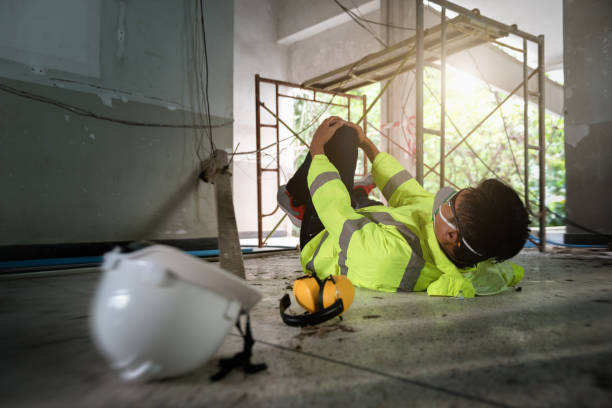 istock Knee accident at work of construction worker at site. Builder accident falls scaffolding on floor, Electric suction, Unsafe in work concept. Add zoom filter effect for feelings. 1334272831