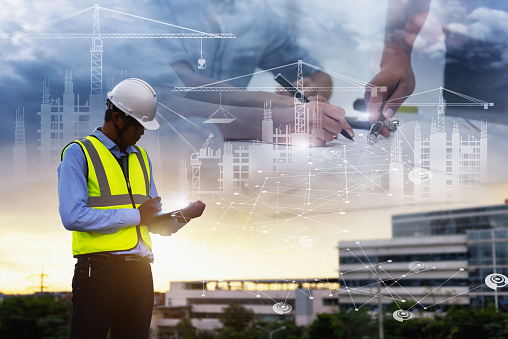 Engineering Consulting People on construction site holding tablet in his hand. Management in business workflow and Building inspector with BIM technology in Construction Project.