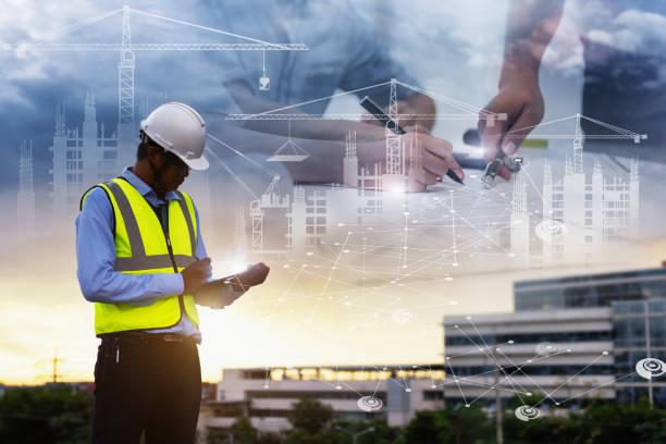 Engineering Consulting People on construction site holding tablet in his hand. Management in business workflow and Building inspector with BIM technology in Construction Project. Engineering Consulting People on construction site holding tablet in his hand. Management in business workflow and Building inspector with BIM technology in Construction Project. building information modeling photos stock pictures, royalty-free photos & images