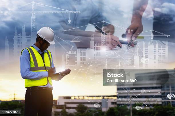 Engineering Consulting People On Construction Site Holding Tablet In His Hand Management In Business Workflow And Building Inspector With Bim Technology In Construction Project Stock Photo - Download Image Now