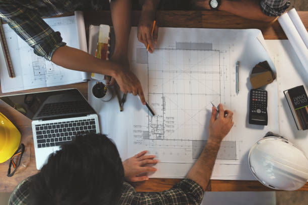 Engineer meeting in modern office with Architecture Interior Designer. Discussion of architectural project and Construction. stock photo