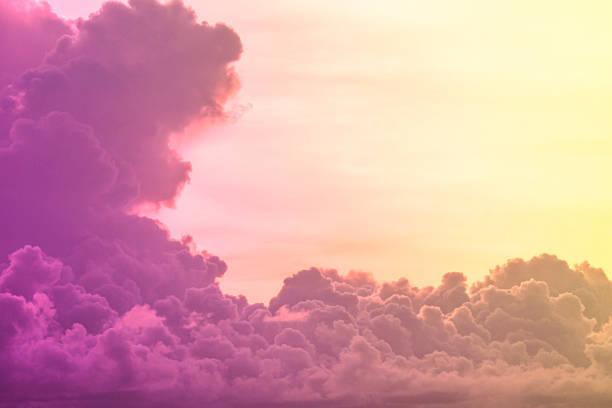 istock beauty abstract sweet pastel soft purple with fluffy clouds on sky. multi color rainbow image. fantasy growing light 1334277811