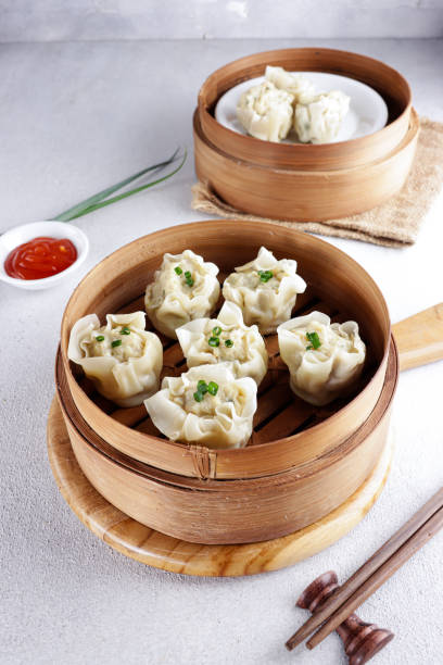 istock Steamed dumpling dimsum in bamboo steamer. 1334280143