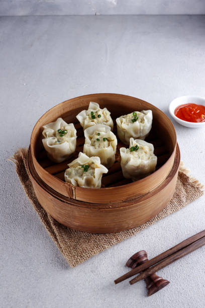 istock Steamed dumpling dimsum in bamboo steamer. 1334280457