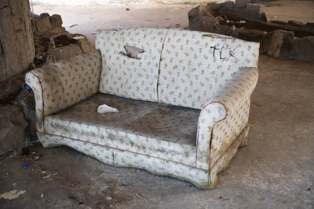 Old vintage sofa.A room in an abandoned hotel in the former tourist complex of Camyuva village, Turkey. A room in an abandoned hotel in the former tourist complex of Camyuva village, Turkey. abandoned place photos stock pictures, royalty-free photos & images