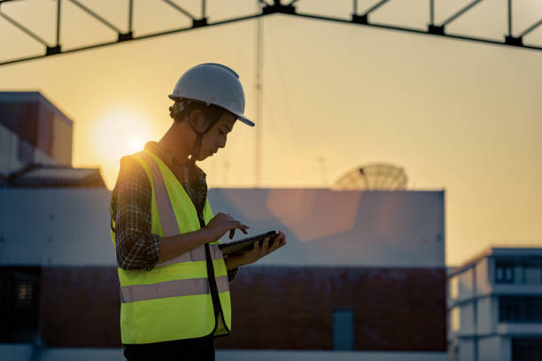 lean business plan construction example images New Engineering teenager people at construction site holding tablet in his hand. Learning in business workflow and Building inspector with BIM technology in construction project while sunset. New Engineering teenager people at construction site holding tablet in his hand. Learning in business workflow and Building inspector with BIM technology in construction project while sunset. lean construction management stock pictures, royalty-free photos & images