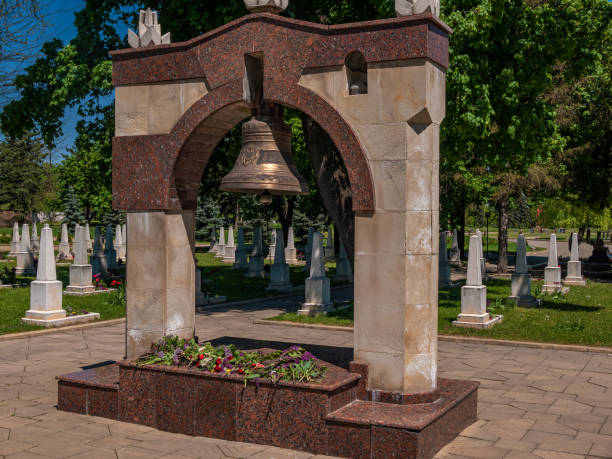 istock Memorial military complex. A large bell in a Christian cemetery. 1334283730
