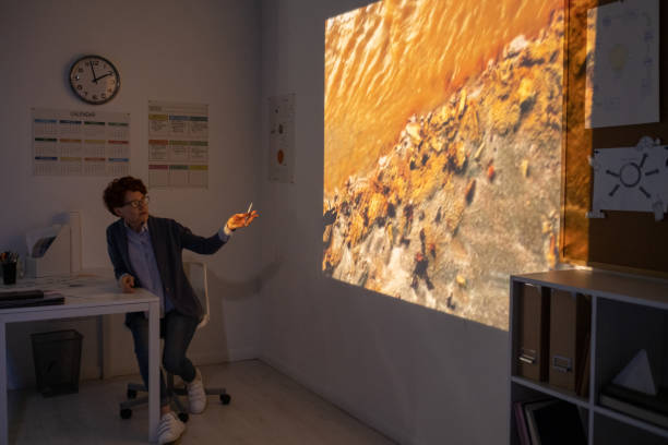 istock Young teacher pointing at polluted water during video presentation 1334284255
