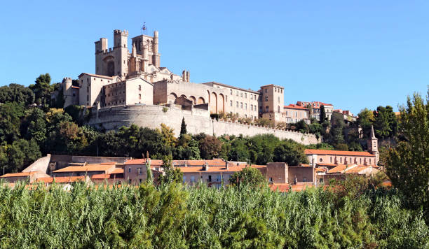 Béziers Cathedral. The Saint-Nazaire cathedral overlooking the houses of Béziers. beziers stock pictures, royalty-free photos & images