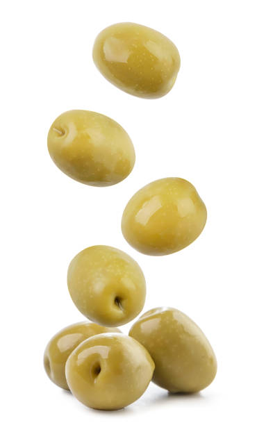 istock Canned olives fly and fall on a heap on a white background, levitating olives. Isolated 1334287156