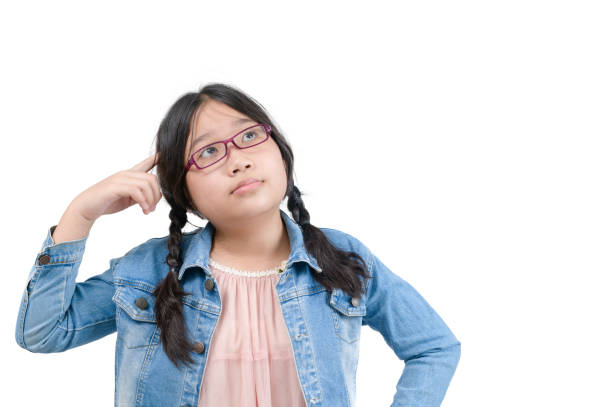 Cute girl in glasses thinking looking in side over white background. education concept