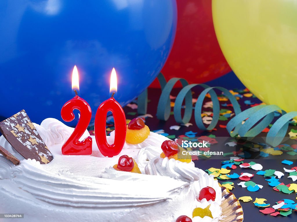 20th. Anniversary 20th. Anniversary / Birthday cake in a Party background with balloons and party strings. 20-24 Years Stock Photo