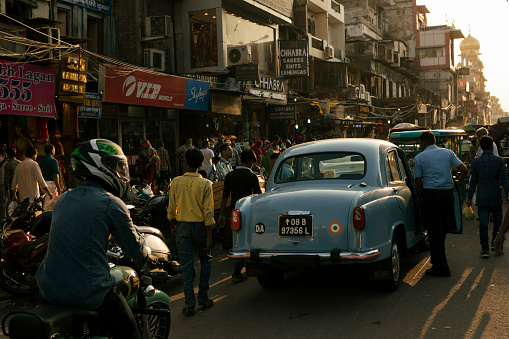 Delhi, India - August 22, 2018: Crowded streets of Chandni Chowk during sunset.