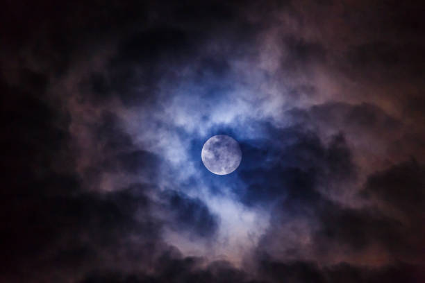 istock Mysterious dark night sky with full moon and cloud. Dark space moon and midnight Halloween concept 1334290083