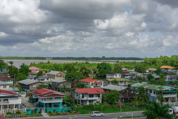 View of a suburb to gerogtown with river crossing in the back Georgetown, Guyana - Nov 8, 2018: View of a suburb to gerogtown with river crossing in the back guyana stock pictures, royalty-free photos & images
