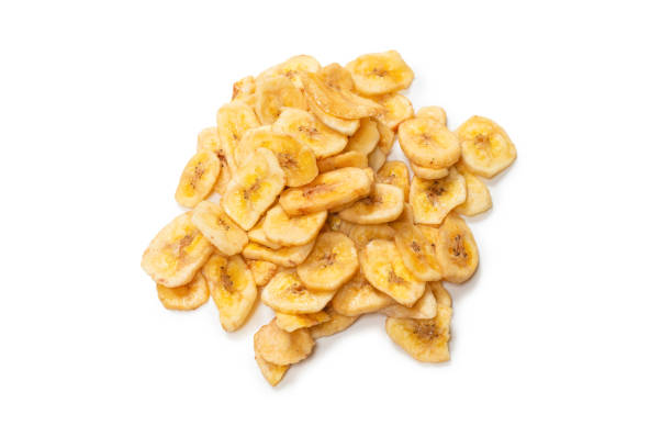 istock Banana chips isolated on a white background. Dehydrated banana. 1334291890