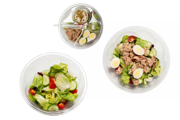 istock Fresh tuna salad with lettuce, cucombers, cherries and eggs in plastic container. 1334291955