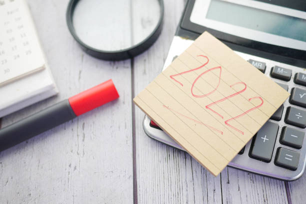 istock 2020 new year goals text on sticky note and stationary on table 1334292135