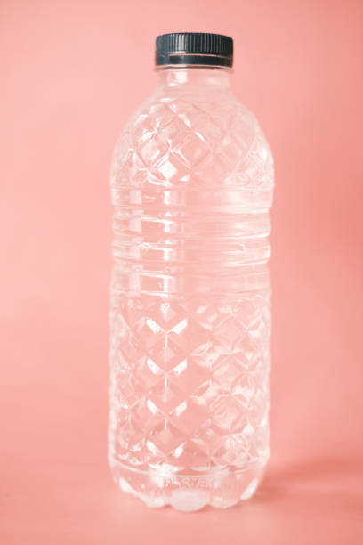 istock fresh drinking water in a plastic bottle on pink 1334292553