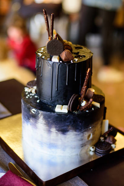 istock Chocolate cake with black glaze and red decoration on a 1334298448