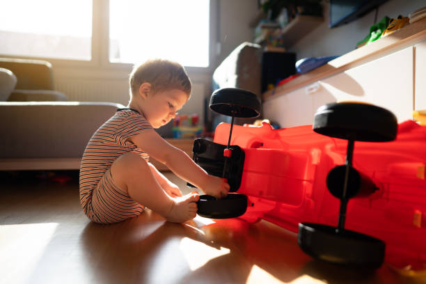 istock Cute young baby boy playing at home 1334298863