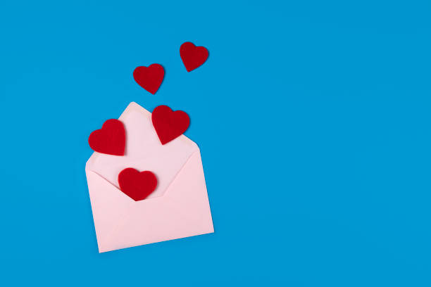 istock Envolope and Red Hearts on Blue Background 1334299465