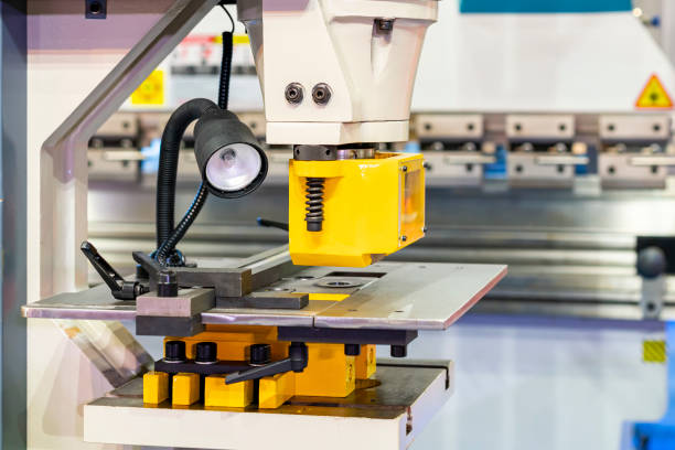 istock punch die or shear set on table semi automatic hydraulic press machine for forming cutting shearing notching punching or hole making of metal sheet in manufacturing process in industrial 1334301036