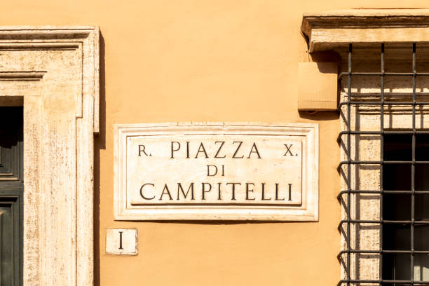 istock Street name piazza campitelli - engl. CAMPITELLI SQUARE -  painted at the wall in Rome 1334302279