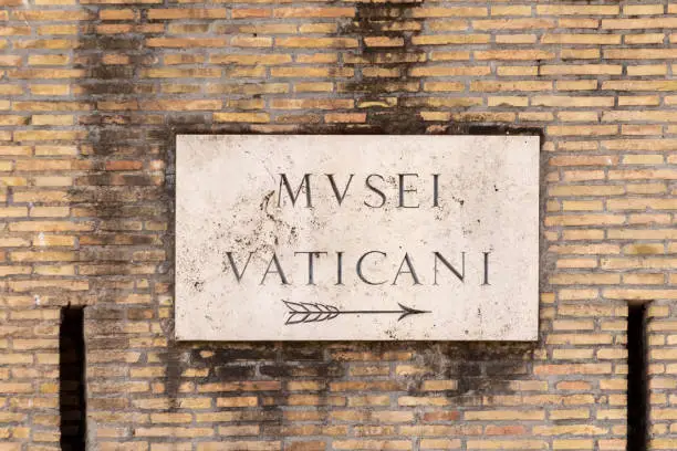 Photo of Street name Musei Vaticani - Engl: vatican museum -  painted at the wall in Rome