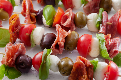 Antipasto Skewers with Mozzarella, Cherry Tomatoes, Basil, Olives and Salami