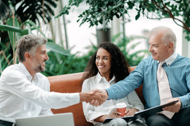 istock satisfied business partners shaking hands . business concept 1334304484