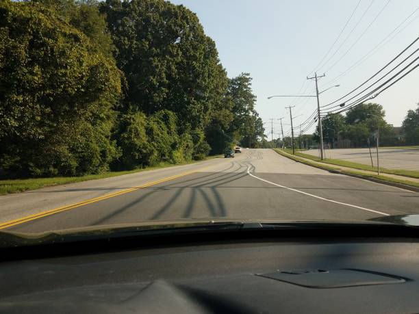 istock shadows on road from power lines view from inside car 1334311911