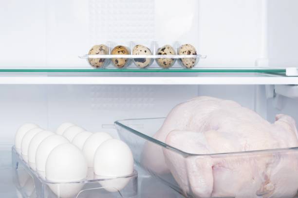 istock fresh chicken and eggs on the shelf in the refrigerator, front view 1334313159